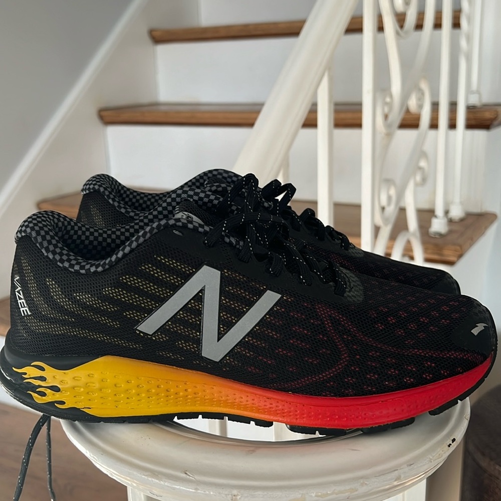 Like new!New balance Disneys CARS kids sneakers size 6.5 Black with orange flame